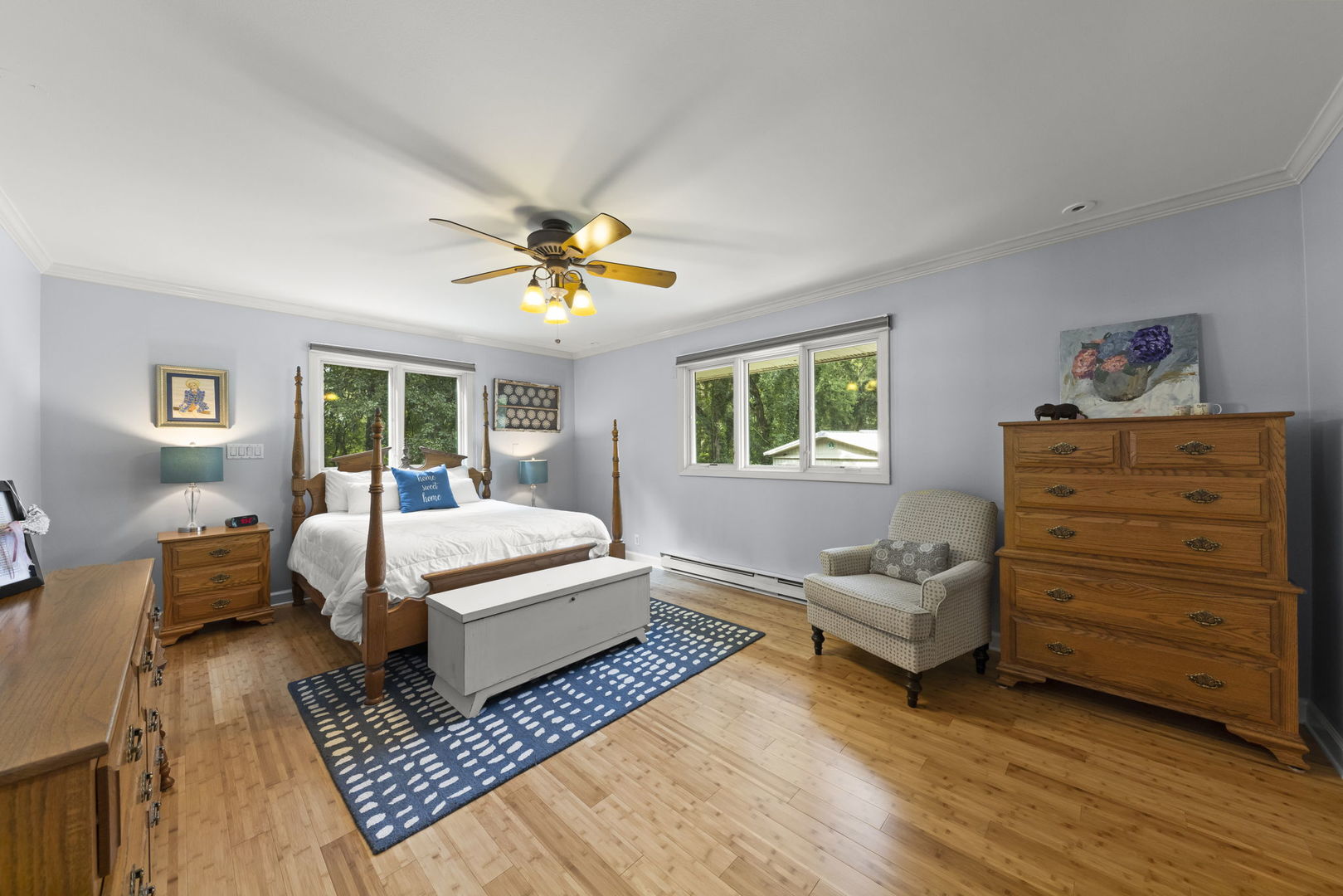 4083 West Sandwich Road Sandwich, IL 60548 - Photo 25 of 74 a spacious bedroom with a bed and wooden floor