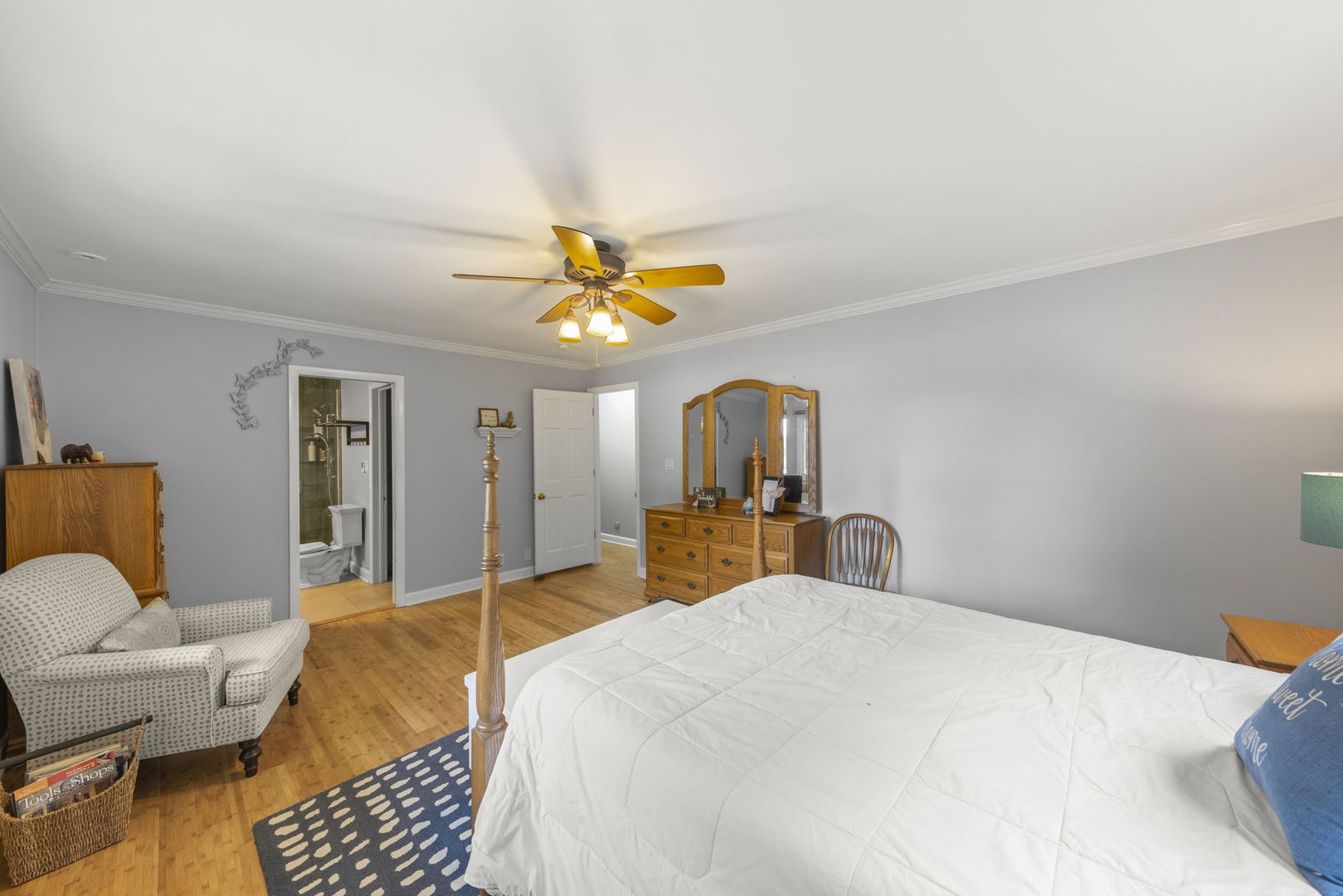 4083 West Sandwich Road Sandwich, IL 60548 - Photo 27 of 74 a bedroom with a bed and wooden floor