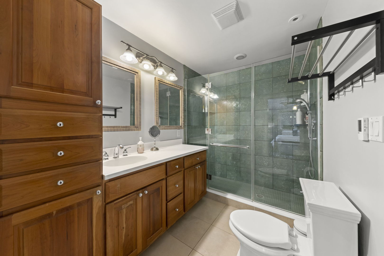 4083 West Sandwich Road Sandwich, IL 60548 - Photo 28 of 74 a bathroom with a double vanity sink toilet mirror and shower