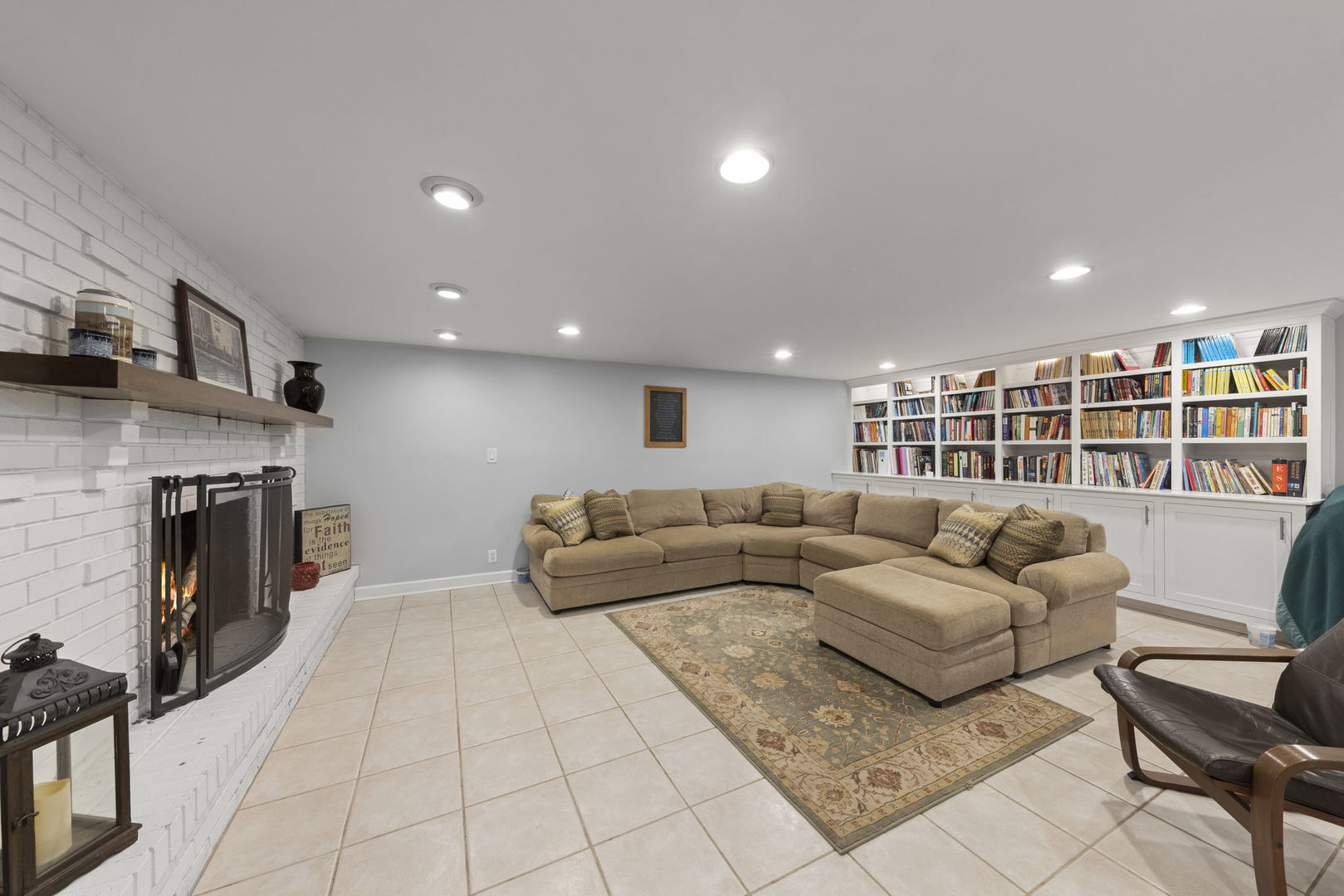 4083 West Sandwich Road Sandwich, IL 60548 - Photo 31 of 74 a living room with furniture and a fireplace