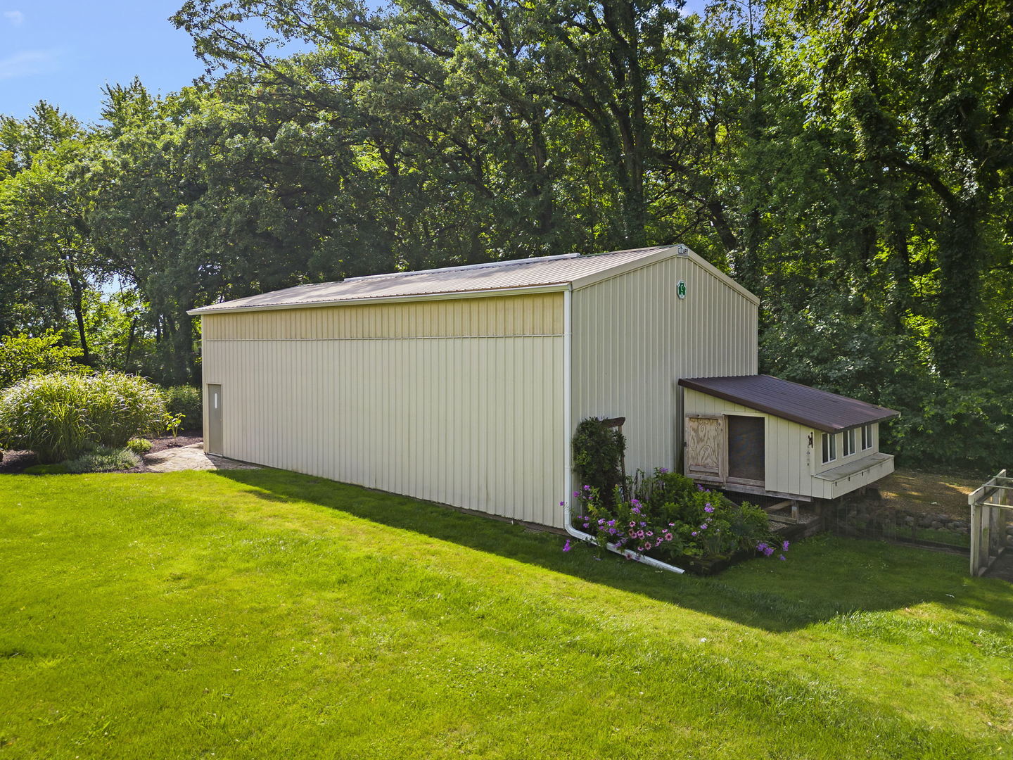 4083 West Sandwich Road Sandwich, IL 60548 - Photo 65 of 74 front view of house with a yard and trees all around