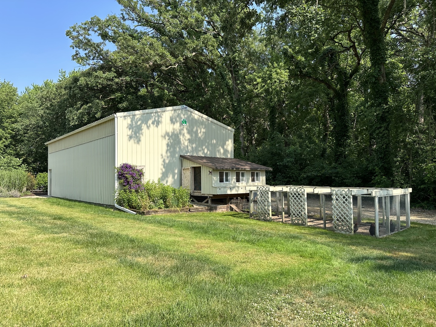 4083 West Sandwich Road Sandwich, IL 60548 - Photo 67 of 74 a view of a house with a big yard and a large tree