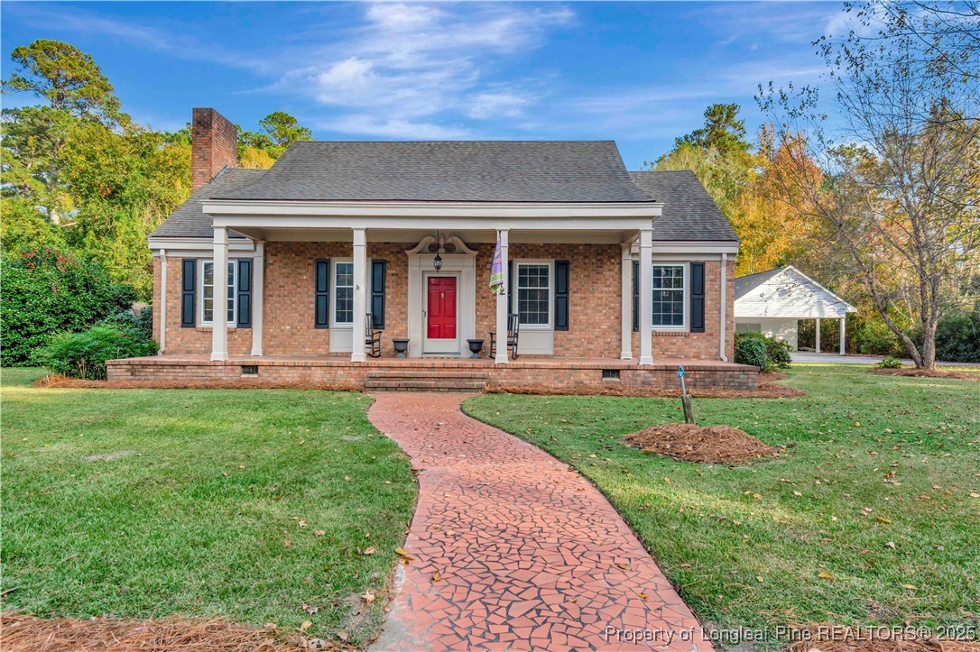 a front view of a house with garden