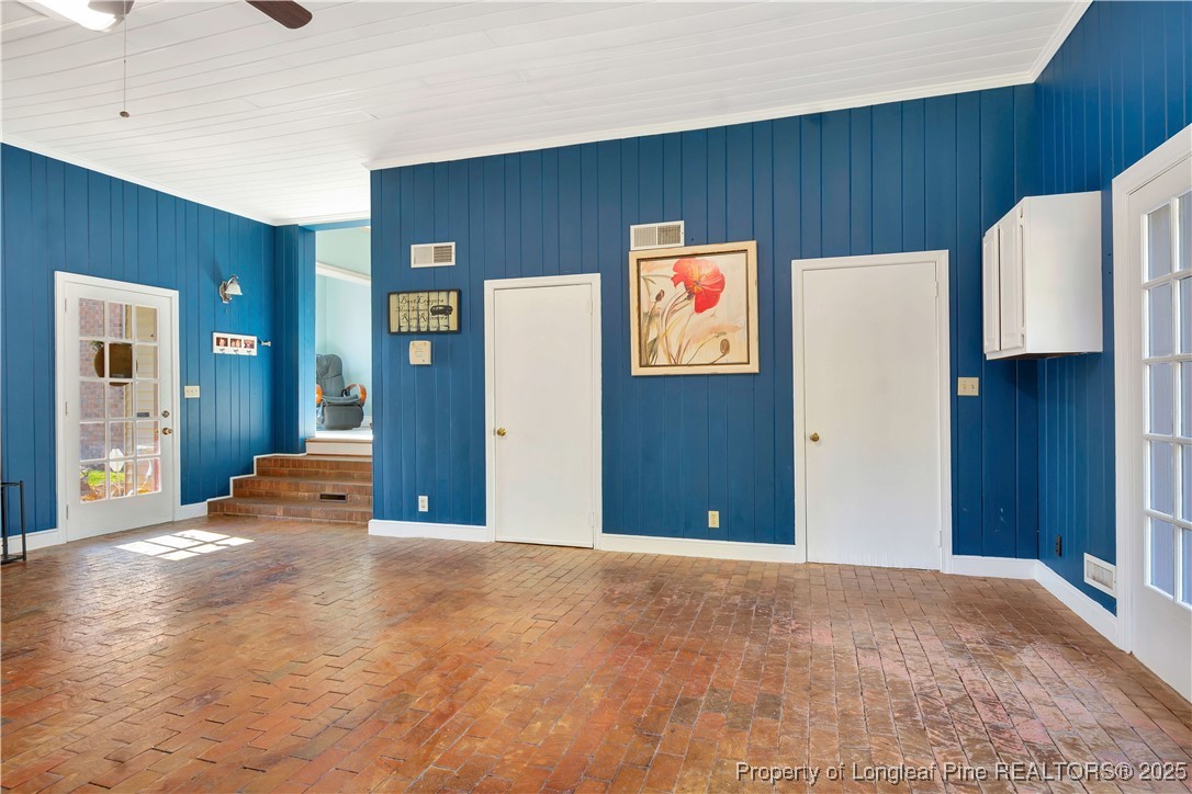 704 B T Road Lumberton, NC 28358 - Photo 18 of 45 a view of an empty room with wooden floor