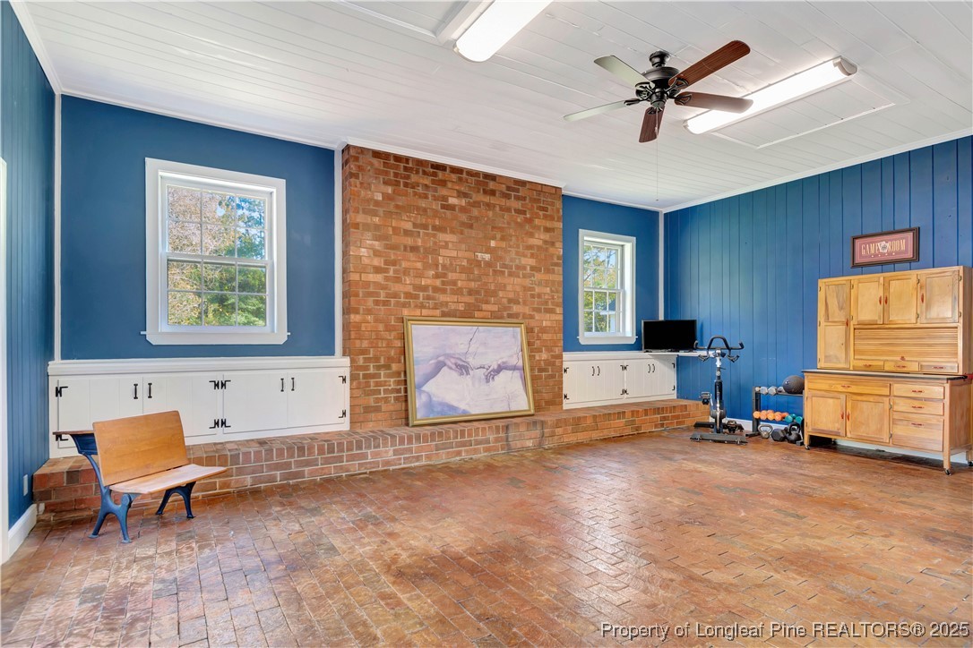 704 B T Road Lumberton, NC 28358 - Photo 19 of 45 a living room with furniture and a fireplace