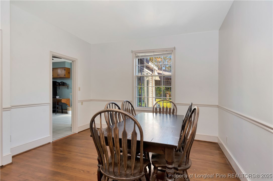704 B T Road Lumberton, NC 28358 - Photo 21 of 45 a view of a dining room with furniture window and wooden floor