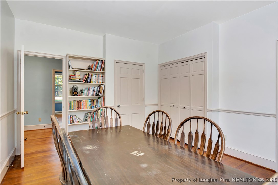 704 B T Road Lumberton, NC 28358 - Photo 22 of 45 a view of a dining room with furniture and wooden floor