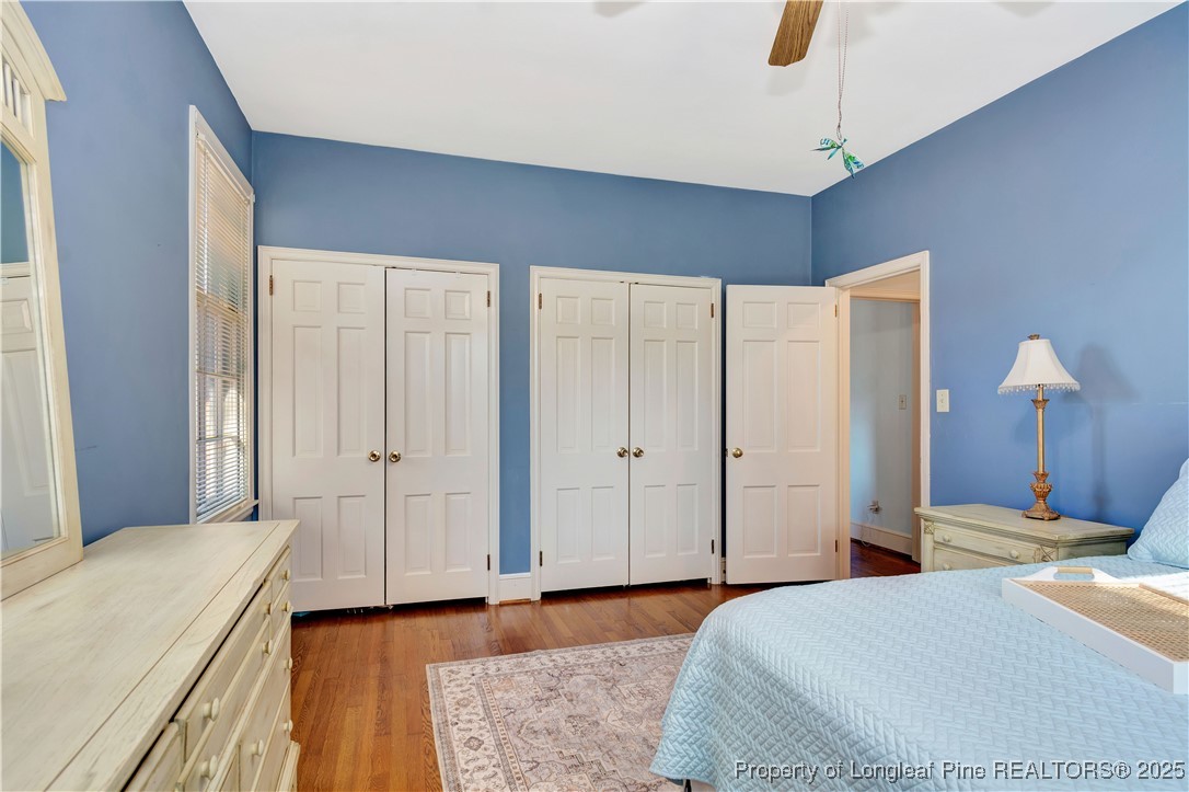 704 B T Road Lumberton, NC 28358 - Photo 26 of 45 a bedroom with a bed and a chandelier
