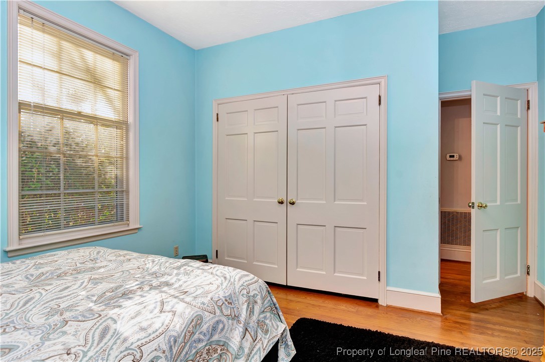 704 B T Road Lumberton, NC 28358 - Photo 29 of 45 a bedroom with a bed and wooden floor