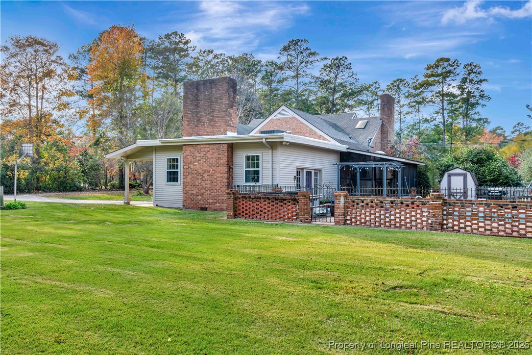704 B T Road Lumberton, NC 28358 - Photo 39 of 45 a front view of a house with garden