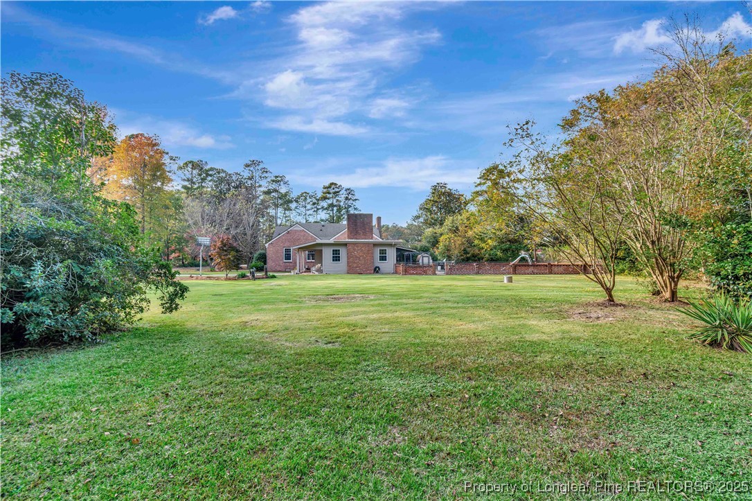 704 B T Road Lumberton, NC 28358 - Photo 44 of 45 a view of a house with a big yard