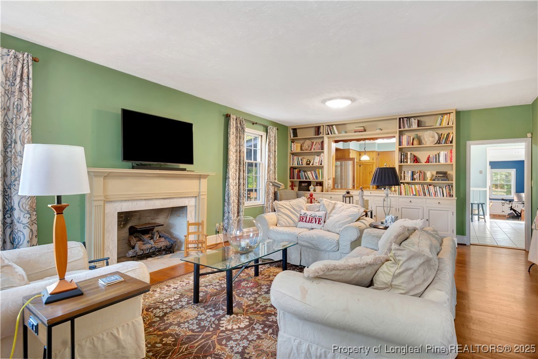 704 B T Road Lumberton, NC 28358 - Photo 8 of 45 a living room with furniture fireplace and a flat screen tv
