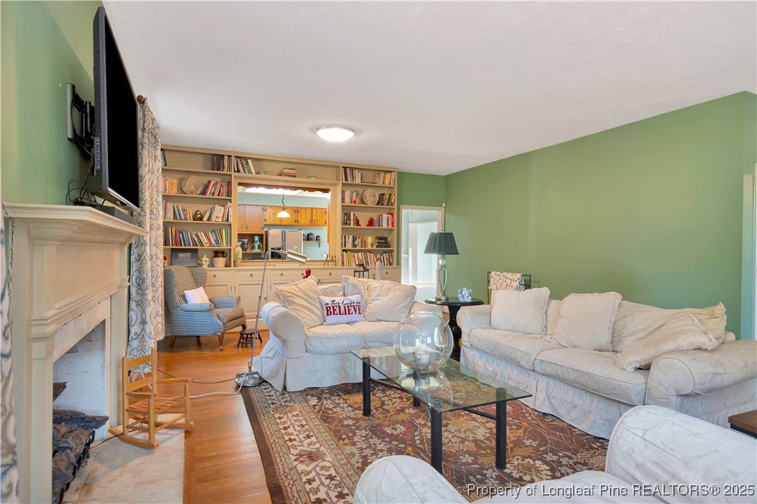 704 B T Road Lumberton, NC 28358 - Photo 9 of 45 a living room with furniture and a flat screen tv