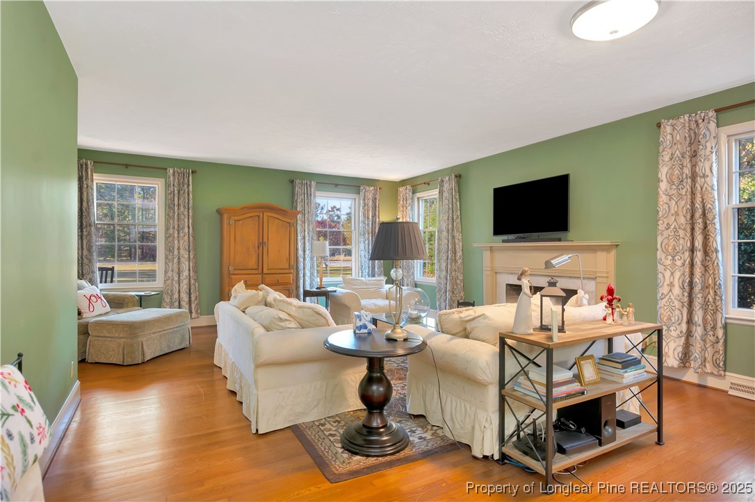 704 B T Road Lumberton, NC 28358 - Photo 10 of 45 a living room with fireplace furniture and a flat screen tv