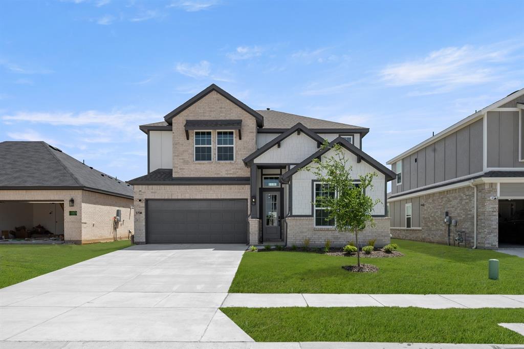1724 Nesting Robin Lane Krum, TX 76249 - Photo 1 of 40 a front view of a house with a yard and garage