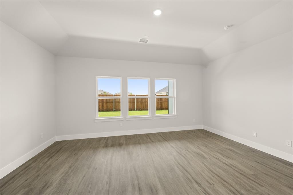 1724 Nesting Robin Lane Krum, TX 76249 - Photo 17 of 40 wooden floor in an empty room with a window