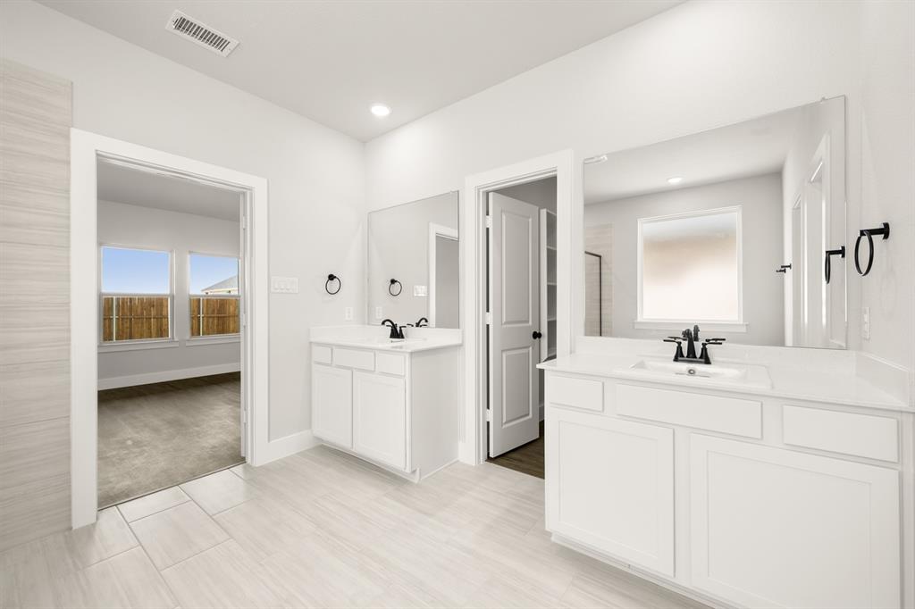 1724 Nesting Robin Lane Krum, TX 76249 - Photo 20 of 40 a spacious bathroom with a double vanity sink mirror and