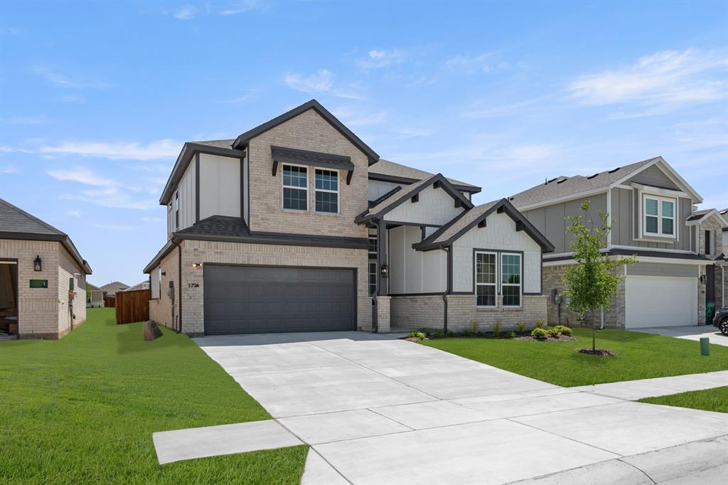 1724 Nesting Robin Lane Krum, TX 76249 - Photo 6 of 40 a front view of a house with a yard and garage