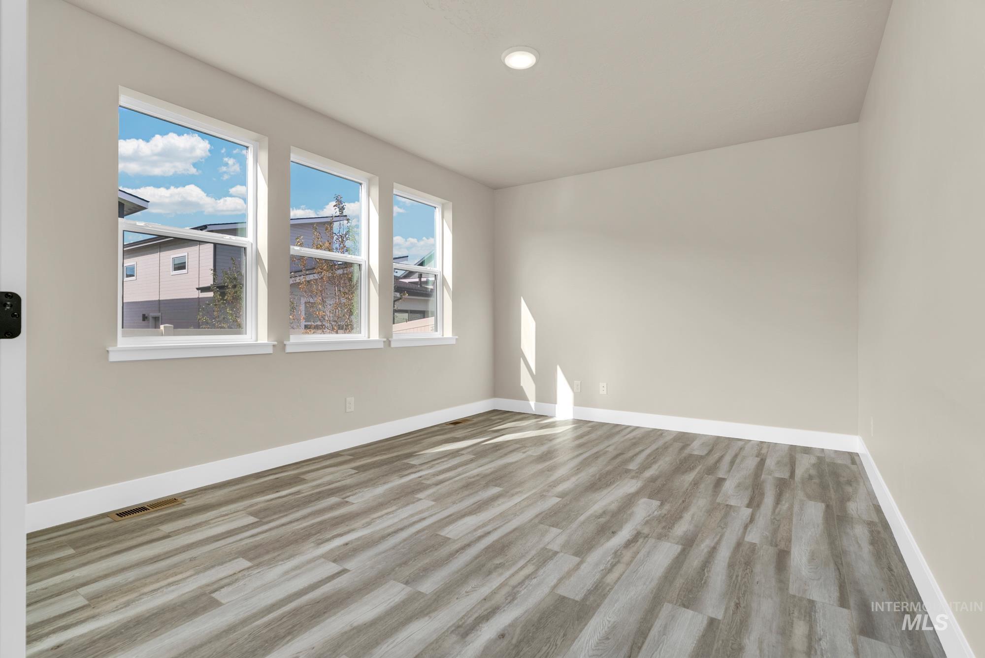 2848 West Jutland Street Meridian, ID 83642 - Photo 11 of 25 Unfurnished room featuring light wood-style floors