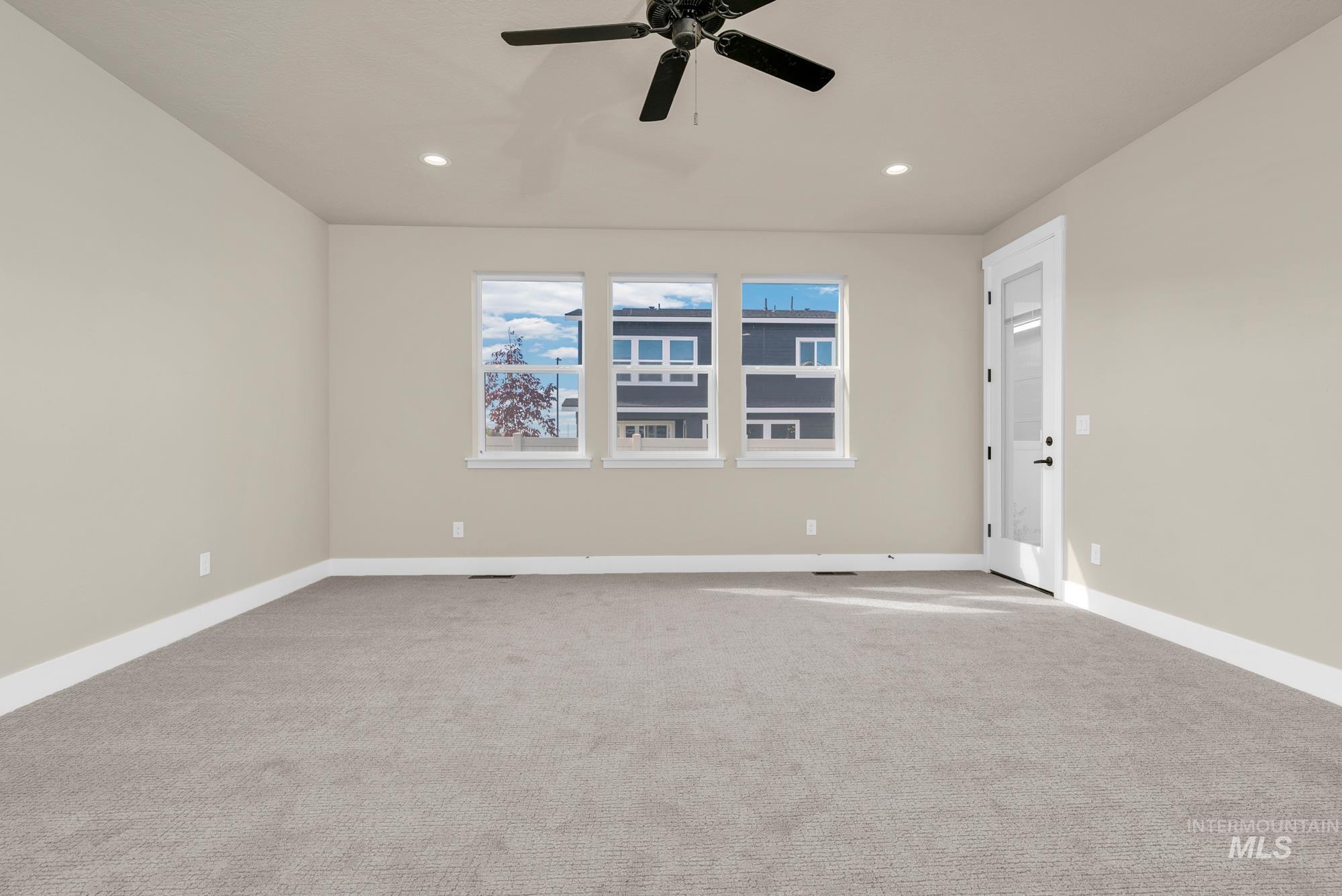2848 West Jutland Street Meridian, ID 83642 - Photo 13 of 25 Empty room featuring carpet floors, a ceiling fan, and recessed lighting