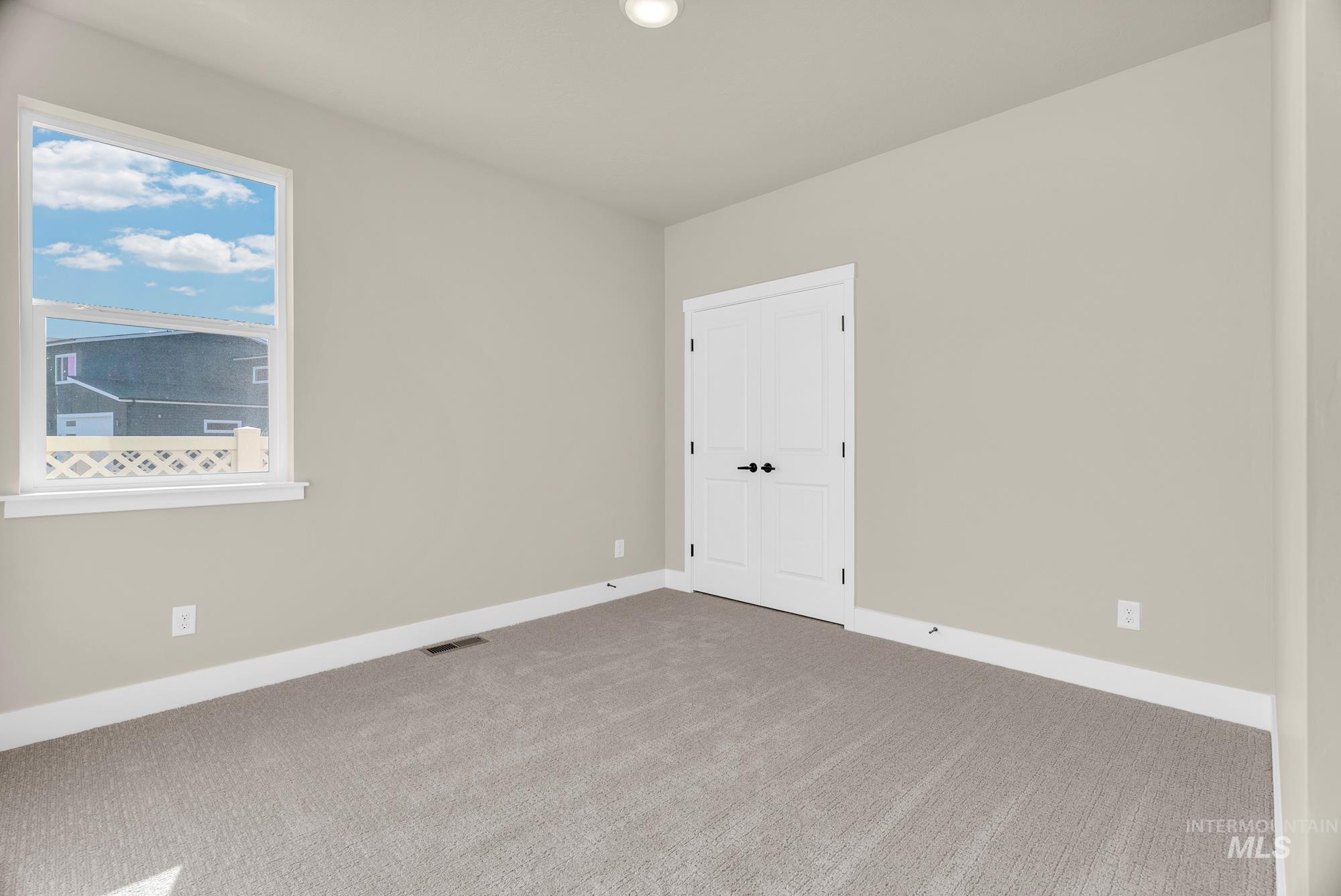 2848 West Jutland Street Meridian, ID 83642 - Photo 19 of 25 Carpeted empty room featuring baseboards