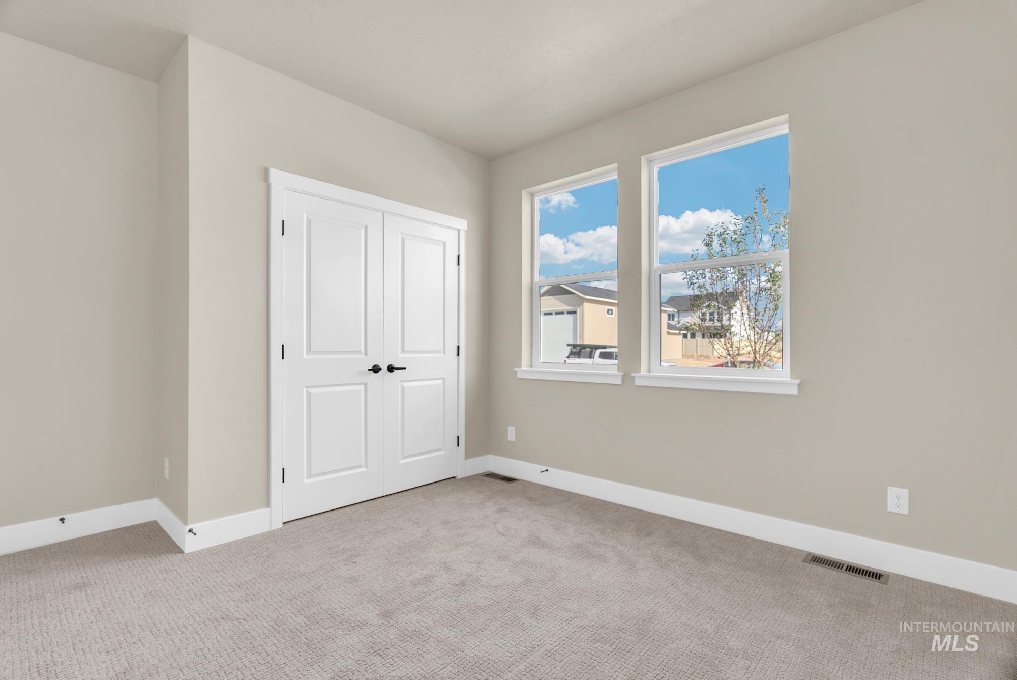 2848 West Jutland Street Meridian, ID 83642 - Photo 22 of 25 Unfurnished bedroom featuring carpet floors and a closet