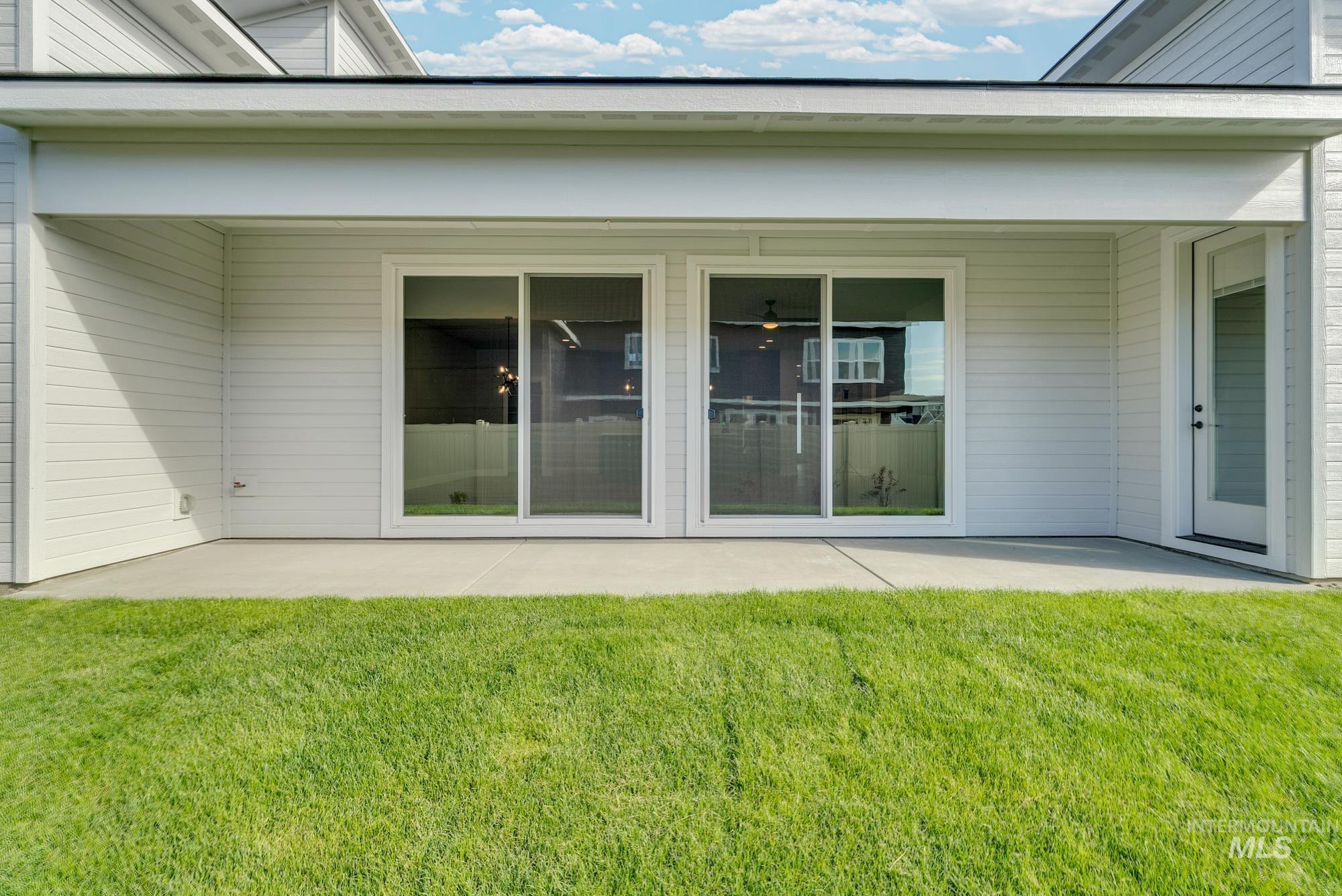 2848 West Jutland Street Meridian, ID 83642 - Photo 24 of 25 Rear view of house featuring a patio area and a yard