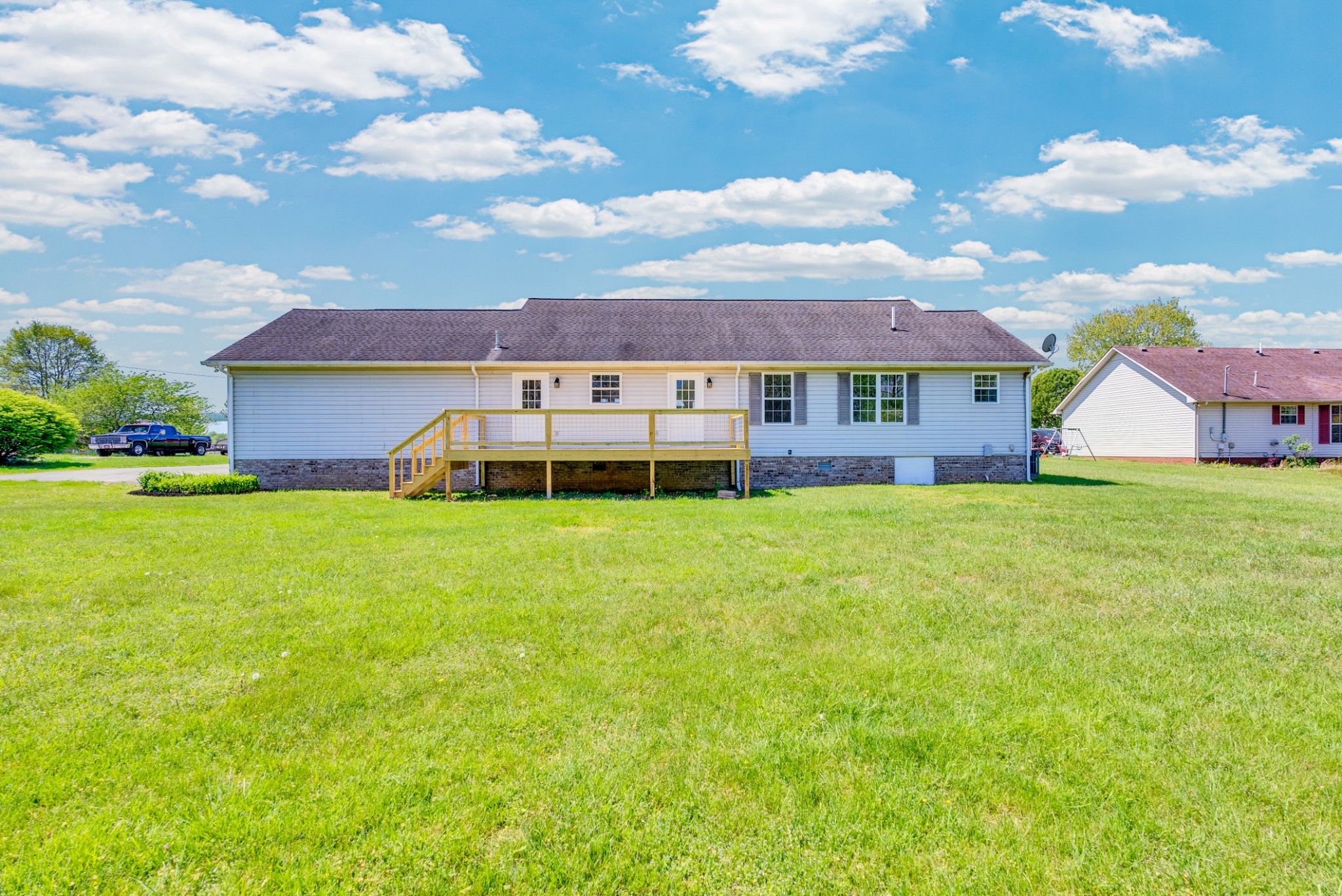 199 Tomahawk Lane Doyle, TN 38559 - Photo 4 of 29 a view of a house with a big yard and large trees