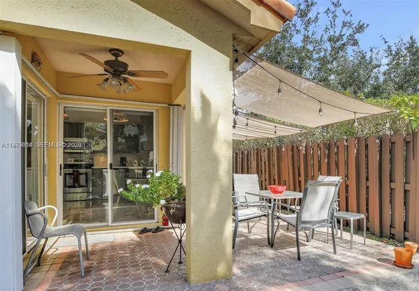 a view of two chairs in patio