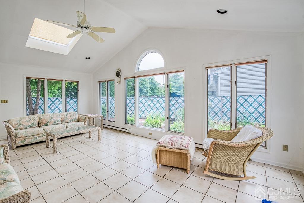 2 Peter Avenue Kendall Park, NJ 08824 - Photo 14 of 19 a living room with furniture and a floor to ceiling window