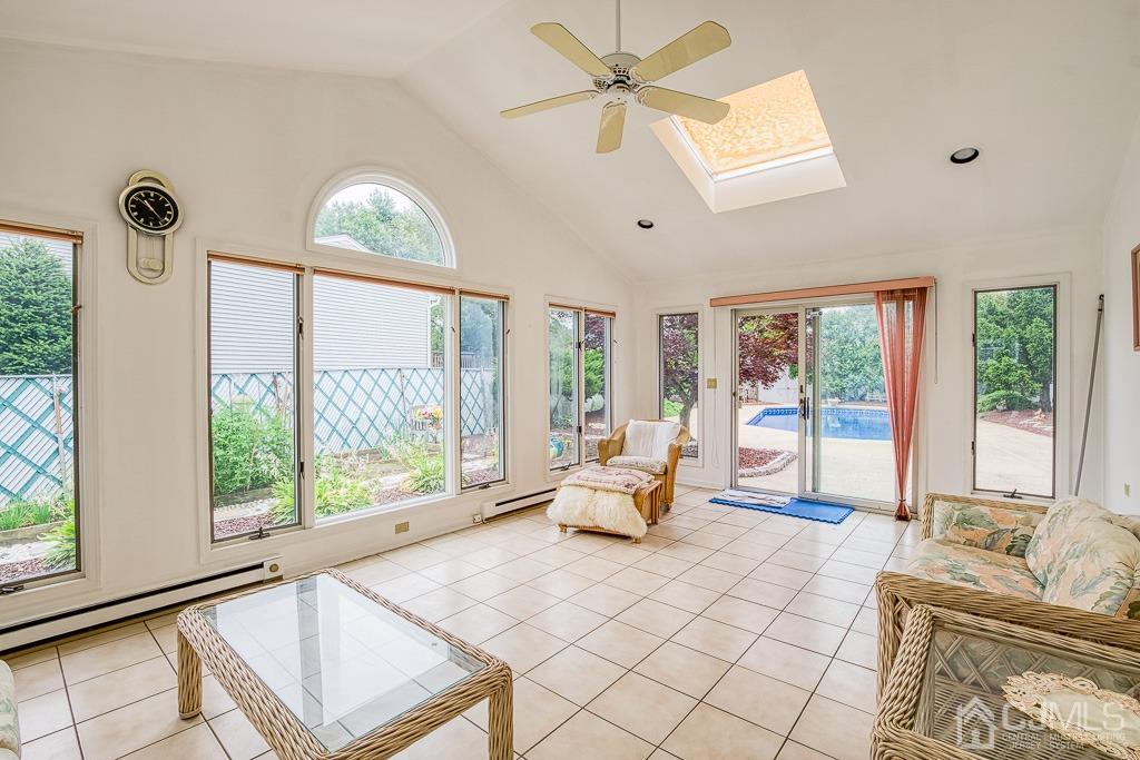 2 Peter Avenue Kendall Park, NJ 08824 - Photo 15 of 19 a living room with furniture and a large window