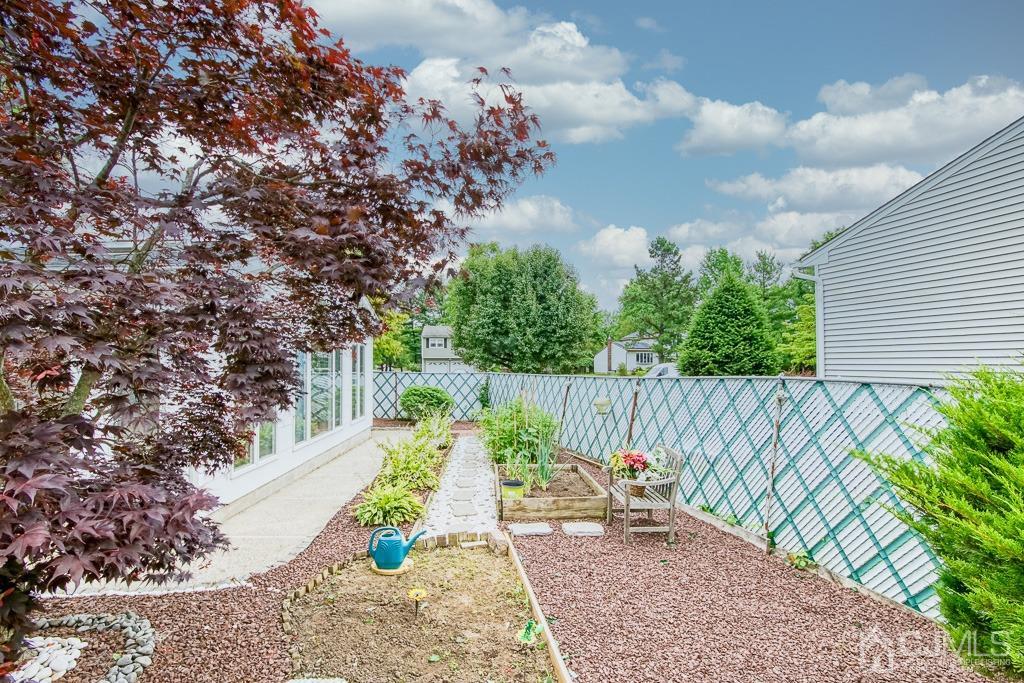 2 Peter Avenue Kendall Park, NJ 08824 - Photo 16 of 19 a view of a backyard with wooden fence