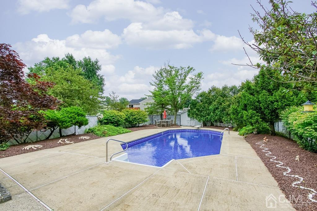 2 Peter Avenue Kendall Park, NJ 08824 - Photo 18 of 19 a view of backyard with swimming pool and outdoor seating