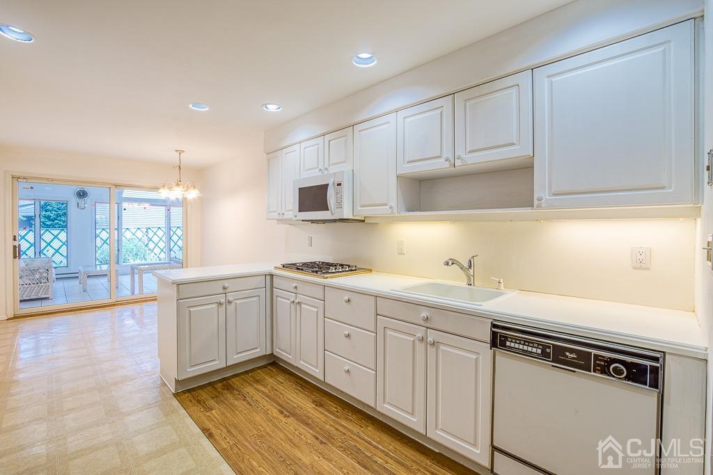 2 Peter Avenue Kendall Park, NJ 08824 - Photo 4 of 19 a kitchen with sink cabinets and window