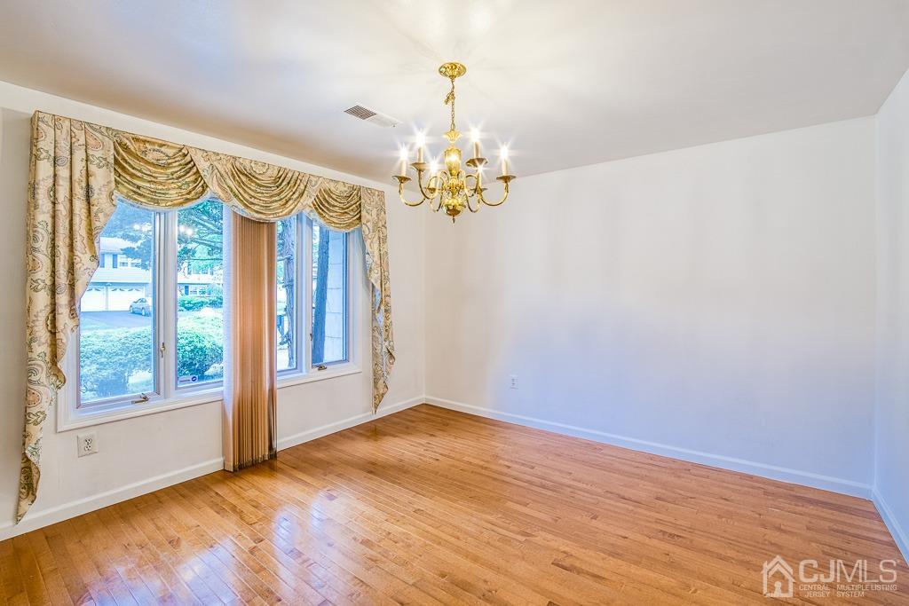 2 Peter Avenue Kendall Park, NJ 08824 - Photo 8 of 19 a view of an empty room with a window