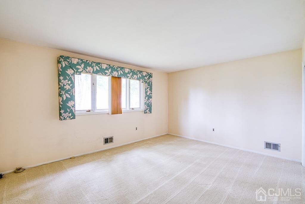 2 Peter Avenue Kendall Park, NJ 08824 - Photo 10 of 19 an empty room with a window