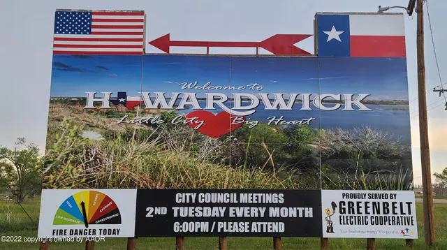 a view of a backyard with table and chairs and a lots of green space