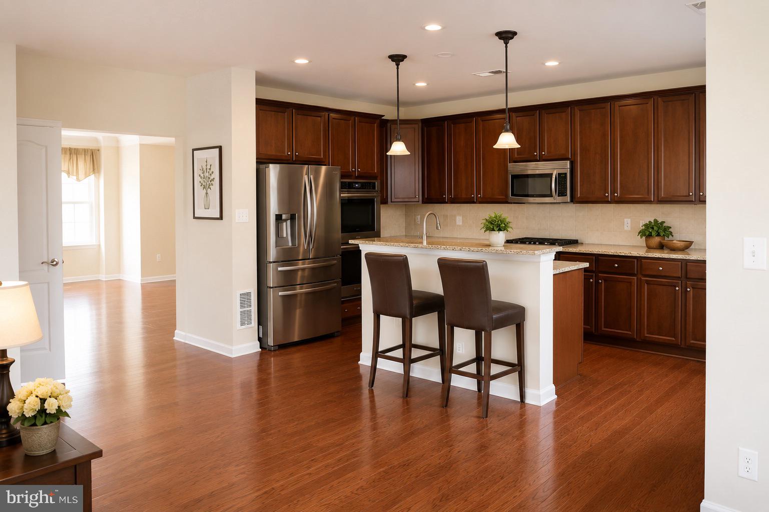 19400 Front Street Leesburg, VA 20176 - Photo 3 of 20 Modern kitchen with warm wood tones.