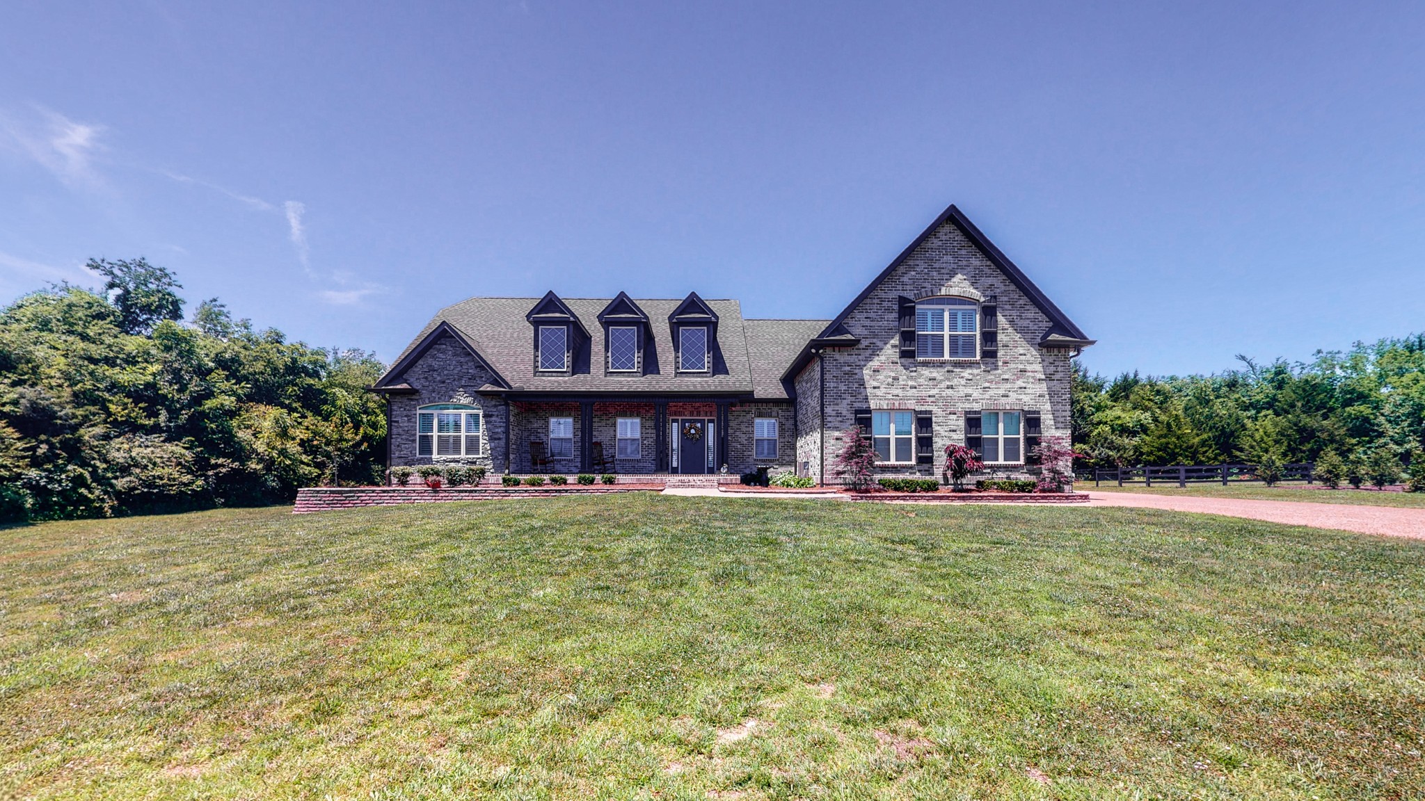 3908 Old Murfreesboro Road West Lebanon, TN 37090 - Photo 2 of 33 a view of a house with a big yard and large trees