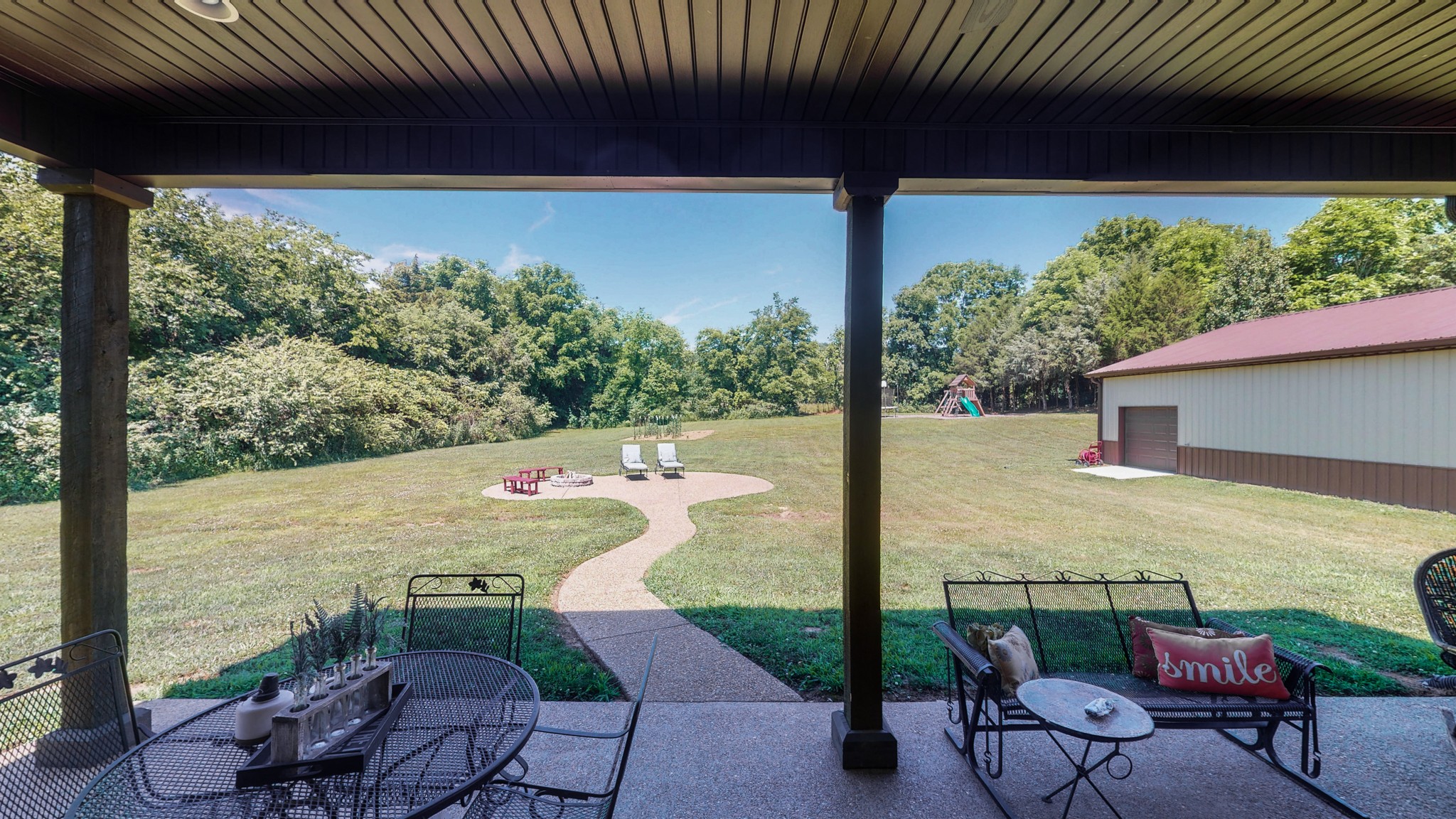 3908 Old Murfreesboro Road West Lebanon, TN 37090 - Photo 7 of 33 a view of a patio with table and chairs potted plants with floor to ceiling window