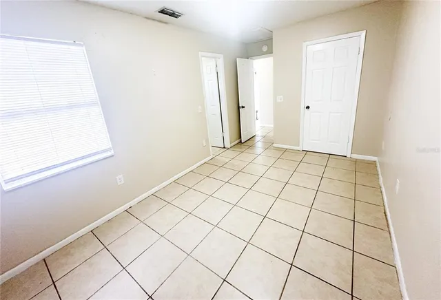 a view of an empty room and window