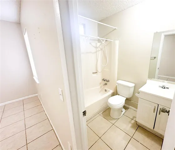 a bathroom with a toilet a sink and a shower