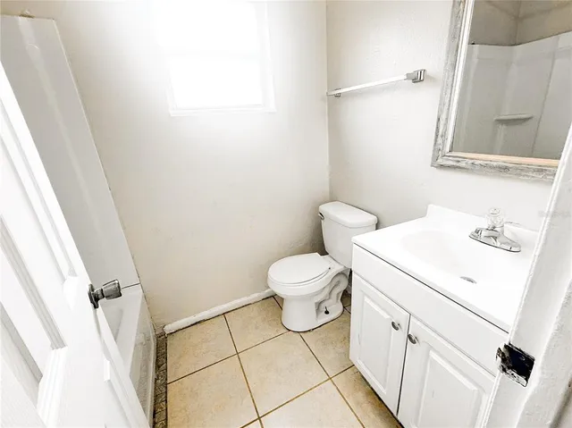 a bathroom with a sink toilet and vanity