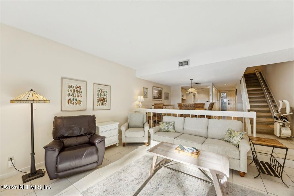 3051 Sea Marsh Road Fernandina Beach, FL 32034 - Photo 11 of 37 a living room with furniture and a night stand