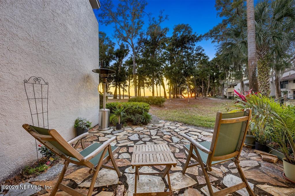 3051 Sea Marsh Road Fernandina Beach, FL 32034 - Photo 23 of 37 a view of a chairs and table in patio