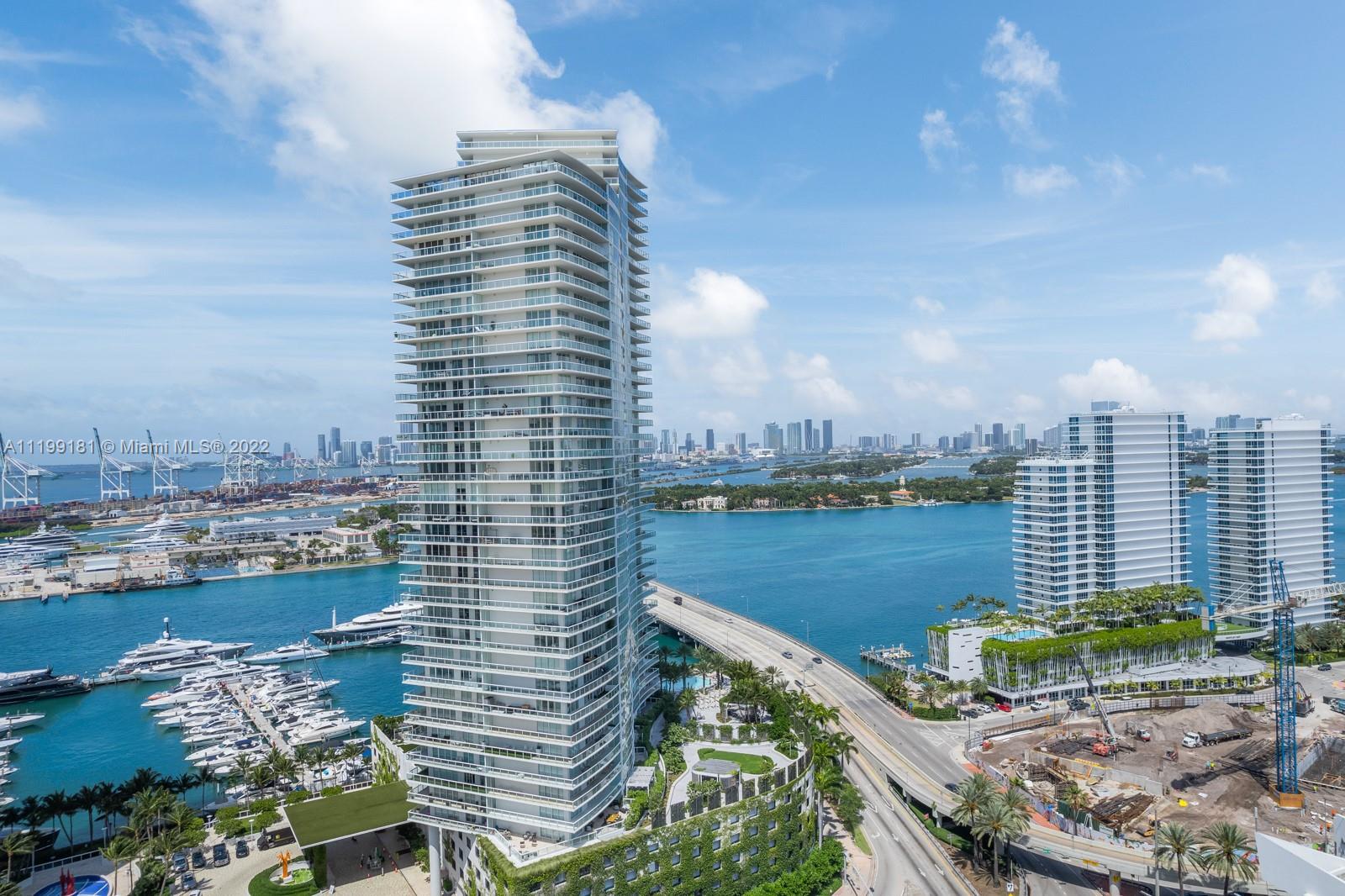 450 Alton Road, Unit 3303 Miami Beach, FL 33139 - Photo 28 of 35 a view of a lake with tall buildings