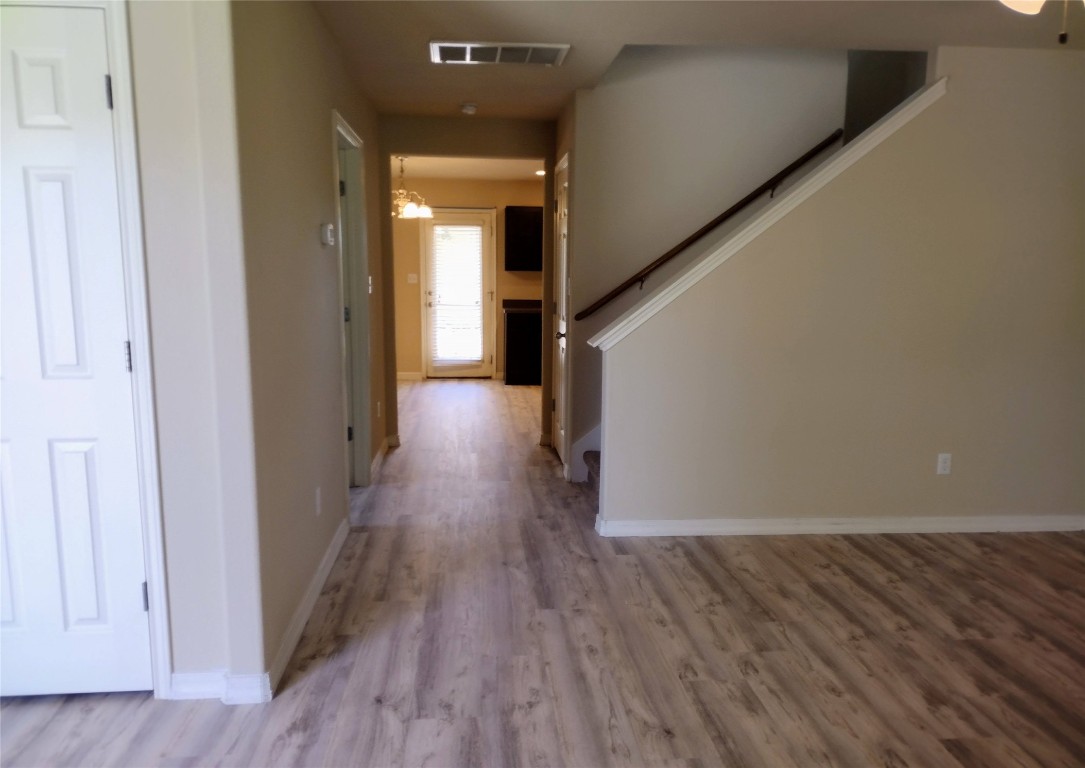 126 Preston Trail San Marcos, TX 78666 - Photo 6 of 24 a view of a hallway with wooden floor