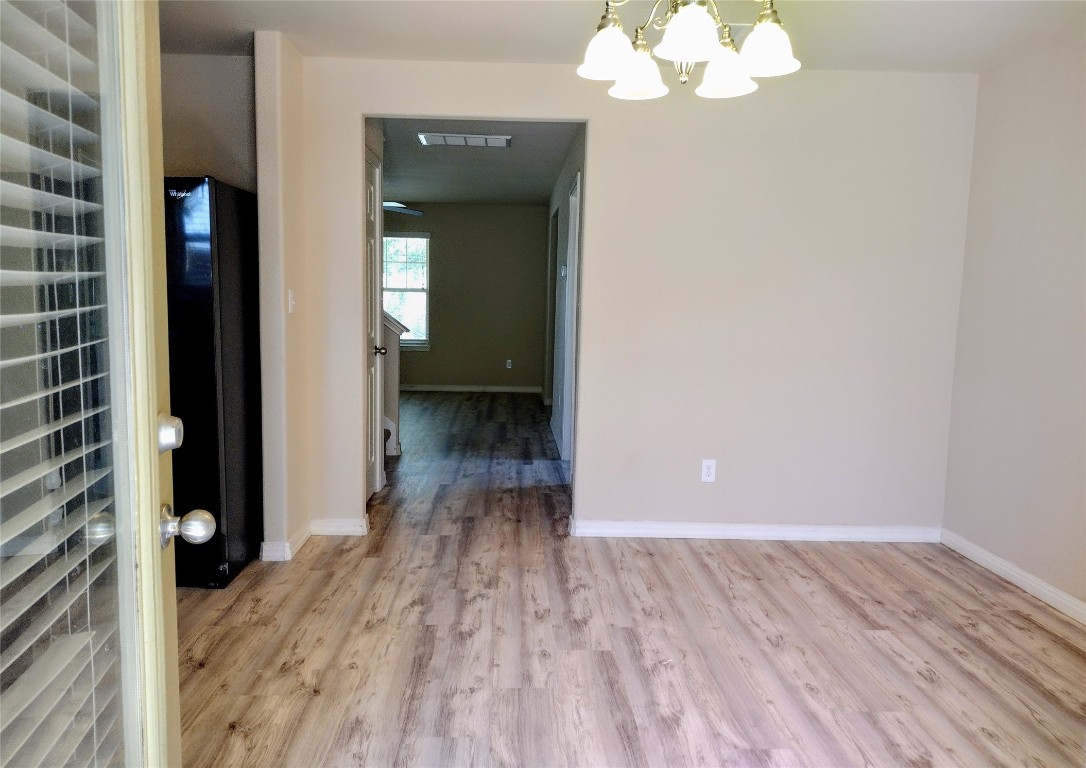 126 Preston Trail San Marcos, TX 78666 - Photo 7 of 24 a view of a room with wooden floor