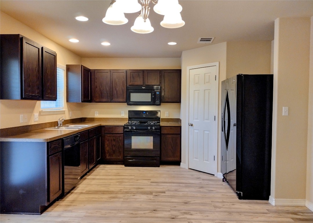 126 Preston Trail San Marcos, TX 78666 - Photo 8 of 24 a kitchen with stainless steel appliances granite countertop a refrigerator and a stove top oven