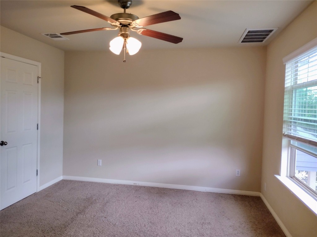 126 Preston Trail San Marcos, TX 78666 - Photo 10 of 24 an empty room with windows and fan